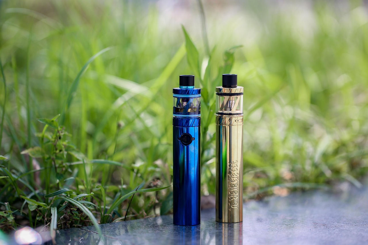 Rows of e-liquid bottles in assorted fruit and mint flavors on shelves